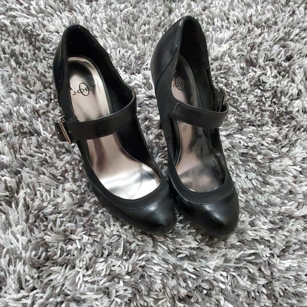 Black leather pumps